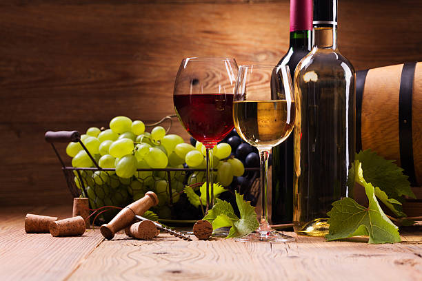 istock Glasses of red and white wine, served with grapes 482607248