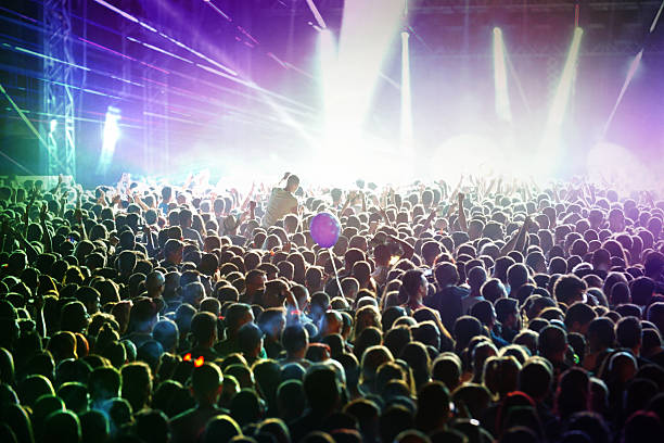 istock People at concert party. 482610786