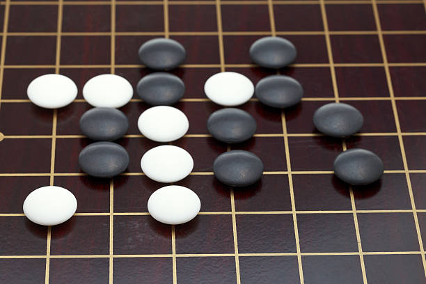 istock position of stones during go game 482613877