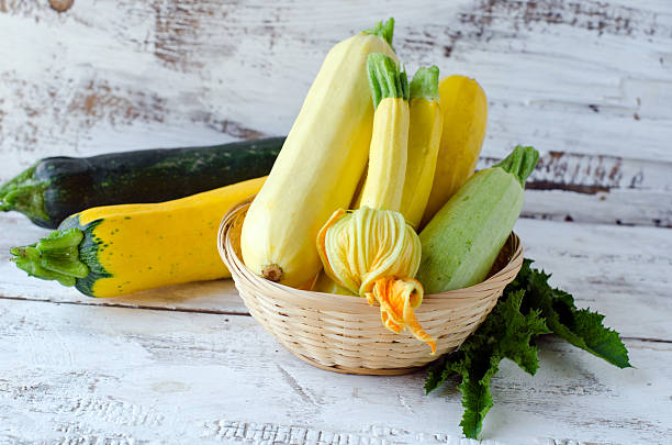 istock Fresh zucchini on a wooden white table 482615227