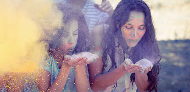 istock Young women having fun with powder paint 482616424
