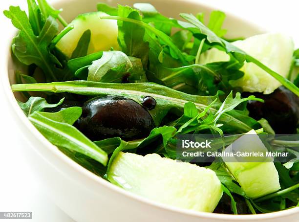 Fresh Salad With Arugula Olives And Balsamic Vinegar Stock Photo - Download Image Now