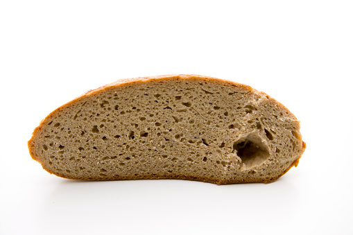 Fresh crust bread half on white background