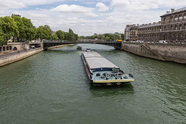 Photo of Barge at river Seine downtown in Paris, France