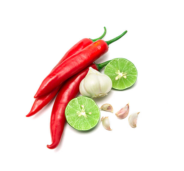 istock red chili , garlic and lime lemon arrange on white background 482623862