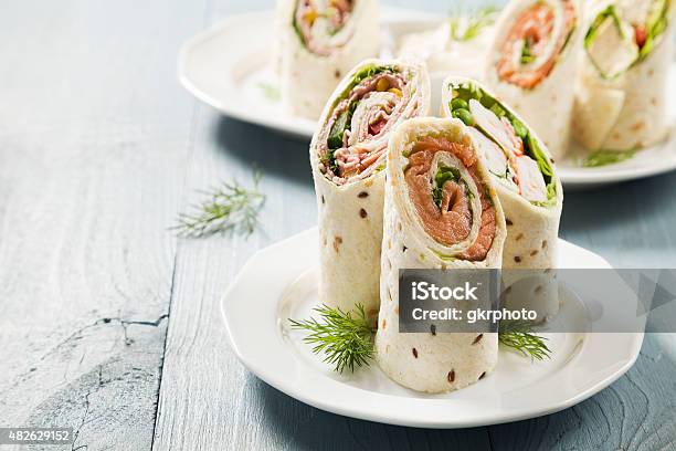 Mix Of Wraps With Ham Chicken Salmon And Crab Served Stock Photo - Download Image Now