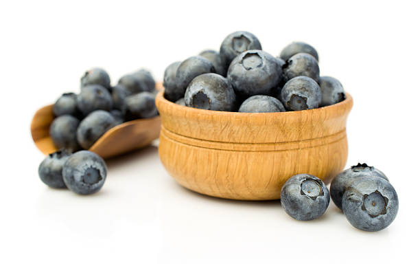 istock Ripe blueberries in wooden bowl 482630382