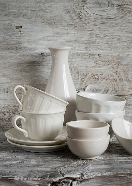 istock white vintage crockery on white wooden background 482630562