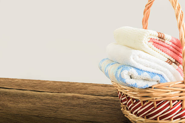 istock Bath towels of different colors in wicker basket 482630804