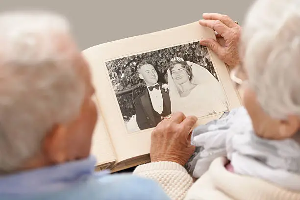 Shot of a senior couple leafing through their wedding albumhttp://195.154.178.81/DATA/shoots/ic_783134.jpg