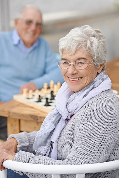 He doesn't know I'm a chess master! An elderly couple playing chess togetherhttp://195.154.178.81/DATA/shoots/ic_783134.jpg senior chess stock pictures, royalty-free photos & images