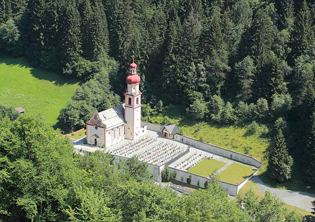 istock Austrian church and graveyard in the Alps 482632755