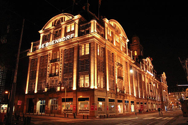 Amsterdam, Holland - January 4, 2014: De Bijenkorf (Amsterdam's largest department store) all lit up at night.