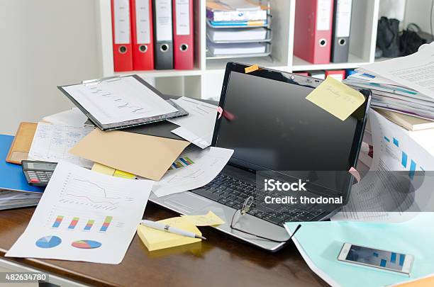 Untidy And Cluttered Desk Stock Photo - Download Image Now - Desk, Messy, Chaos