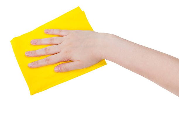 istock hand with yellow cleaning rag isolated on white 482635076
