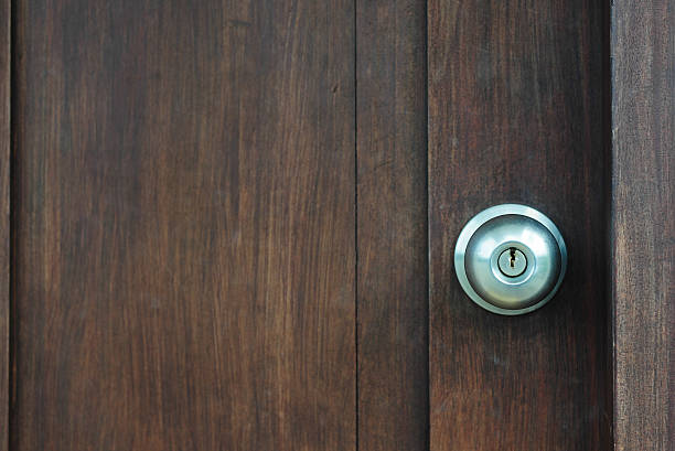 istock Door knob on wooden door 482635129