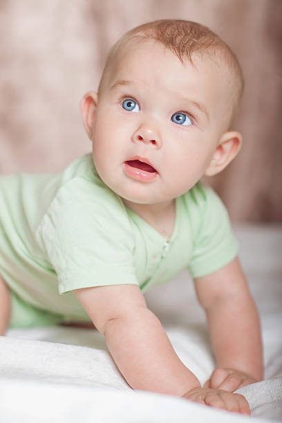 istock Sweet baby on the bed smiling 482637247
