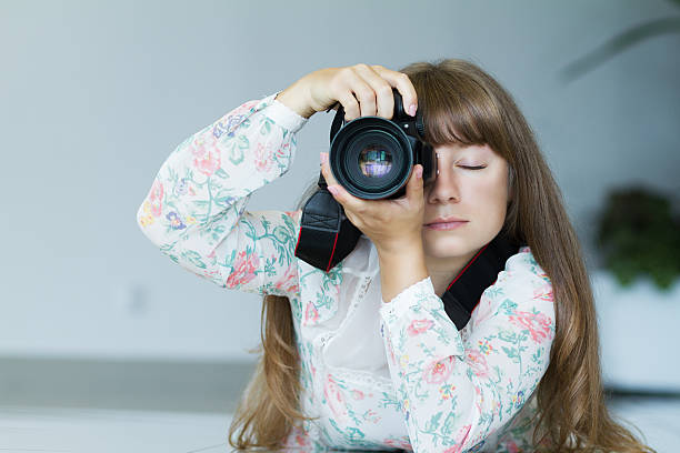 istock Photographer girl with a camera 482643492