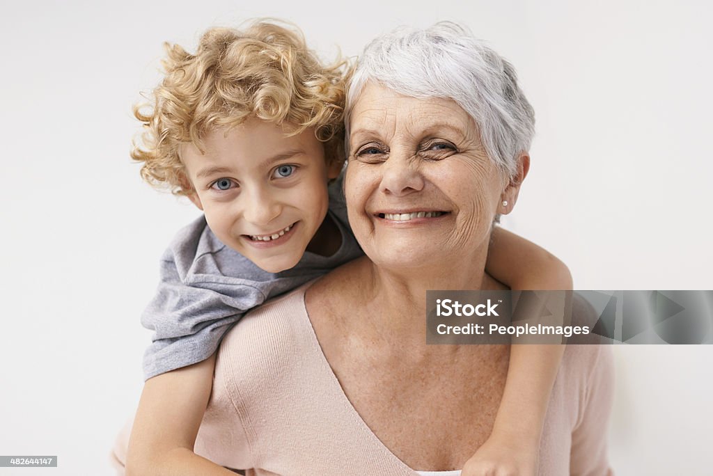 I love my gran! Portrait of a grandmother giving her grandson a piggyback ride Grandmother Stock Photo