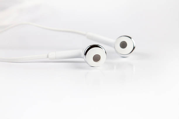 istock selective focus of earphones on white background 482644510