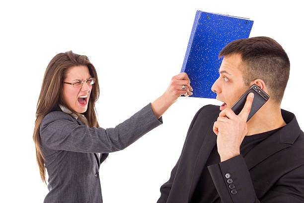 istock man caught in a lie and woman screaming 482644695