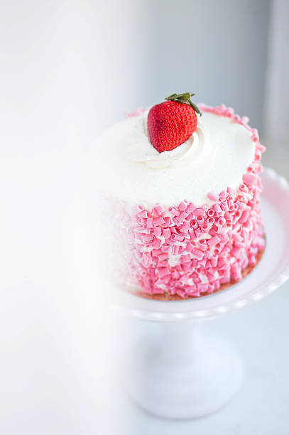 istock Strawberry cake with white cream on wooden background 482644763