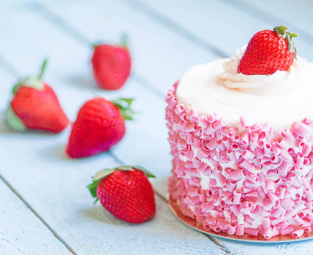 istock Strawberry cake with white cream on wooden background 482644819