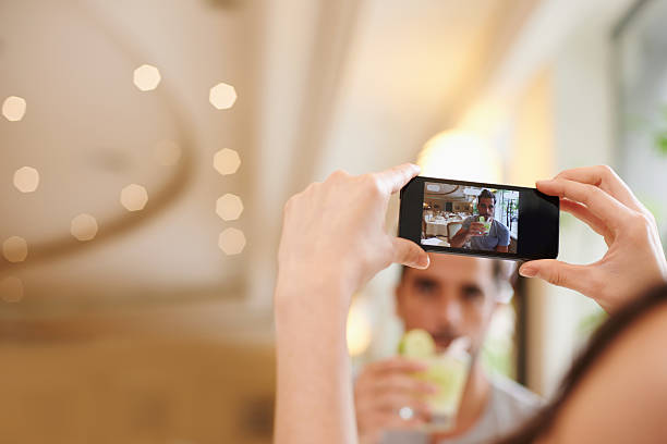 istock Taking a pic of her man and his cocktail 482644855