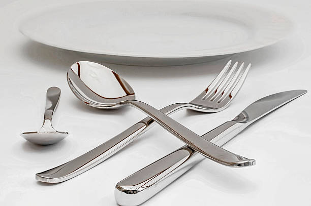 istock Cutlery shiny and a flat white plate 482647010