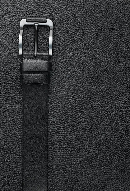 Black belt lies on the natural leather