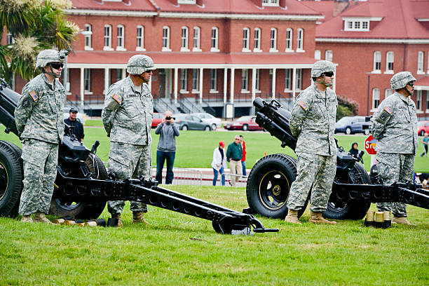San Francisco, USA - May 27, 2013: US Memorial Day Ceremony, The Presidio National Cemetery, San Francisco. Veterans and citizens are attending the cemetery.  The Ceremony was also dedicated to the 60th Anniversary of Korean War (1950-1953) remembering and honoring more than 50.000 Americans killed during that war. Everything is ready for he spectacular  21-Gun Salute at the end of Ceremony performed by 75th Pacific Division. 
