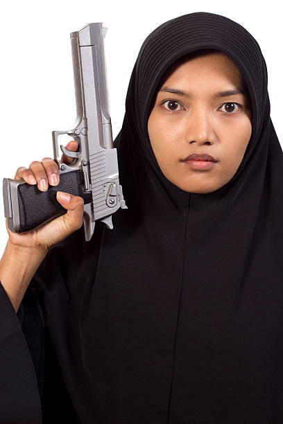istock Woman with gun 482649348