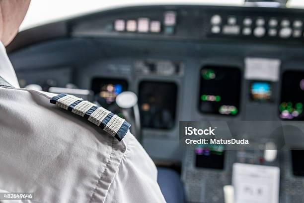 Pilot In Cockpit Stock Photo - Download Image Now - Pilot, Piloting, Boat Captain