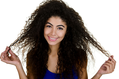 Headshot of a beautiful woman with curly hair 