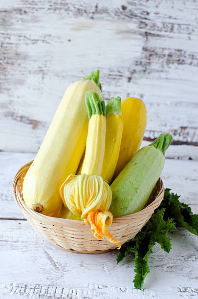 istock Fresh zucchini on a wooden white table 482650021