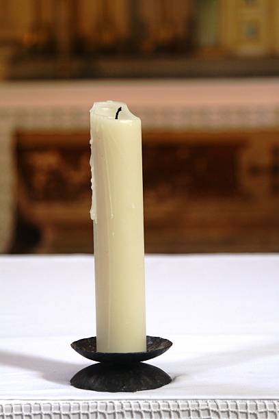 istock Candle in a church 482650190