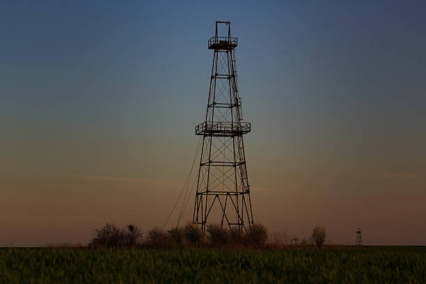 istock Oil and gas rig tower profiled on sky 482650931