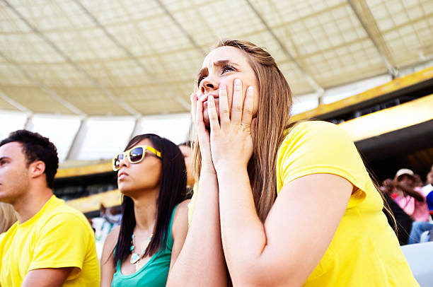 istock Anxious soccer fans at stadium worry about their team 482651393