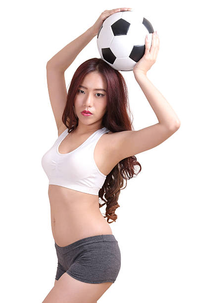 istock woman and football 482658184