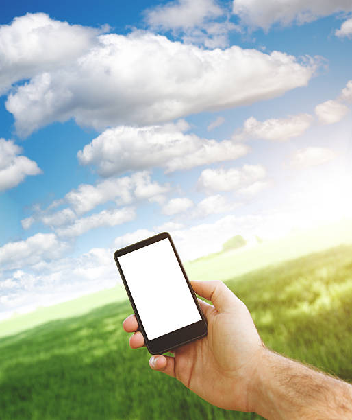 istock holding a new smartphone outdoors 482658485