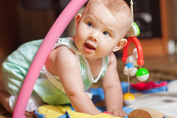 istock Little baby playing with toys 482658851