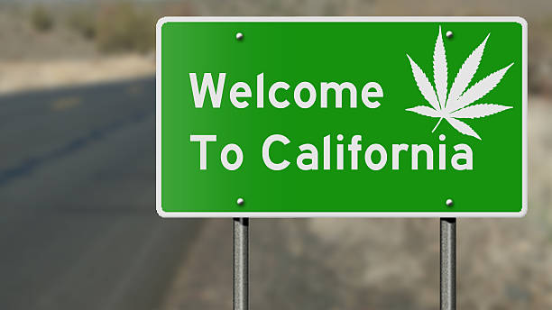 Welcome to California highway sign with marijuana leaf stock photo