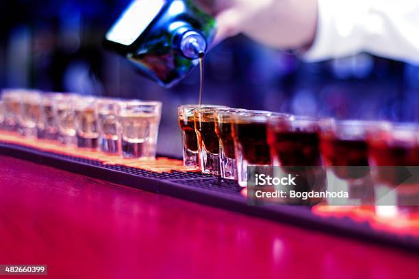 Bartender Pouring Strong Alcoholic Drink Stock Photo - Download Image Now - Adult, Alcohol - Drink, Amber