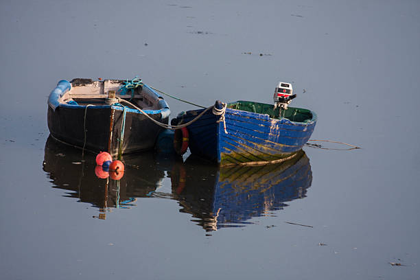 Boats at low tide, River Suir, Waterford, Ireland stock photo