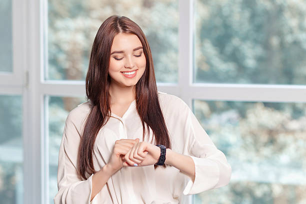 istock Smiling businesswoman watching time 482662712