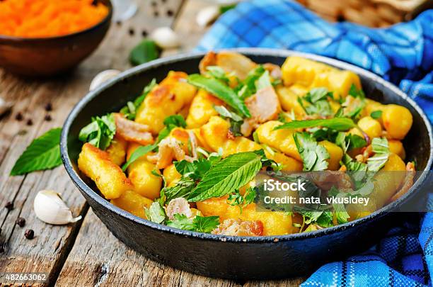 Potatoes Pumpkin Gnocchi With Bacon Cilantro And Mint Stock Photo - Download Image Now