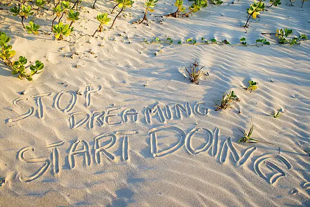 Photo of Stop dreaming start doing! Creative motivation concept.