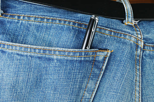 istock Blue denim jeans with ball pen inside. 482663724
