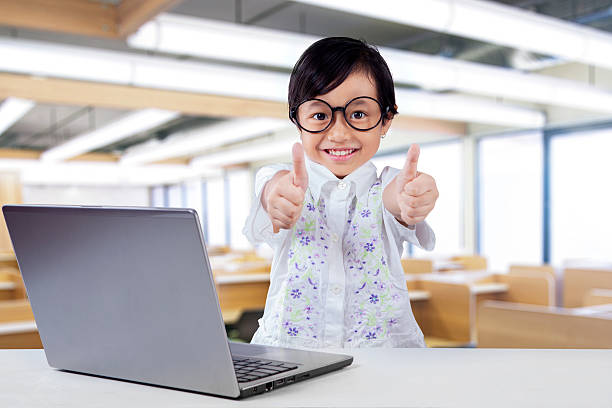 istock Cheerful girl shows hands gesture in the classroom 482666916