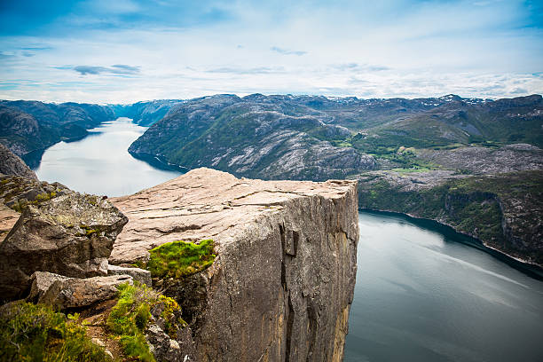 Preikestolen or Prekestolen Preikestolen or Prekestolen, also known by the English translations of Preacher's Pulpit or Pulpit Rock, is a famous tourist attraction in Forsand, Ryfylke, Norway crag stock pictures, royalty-free photos & images